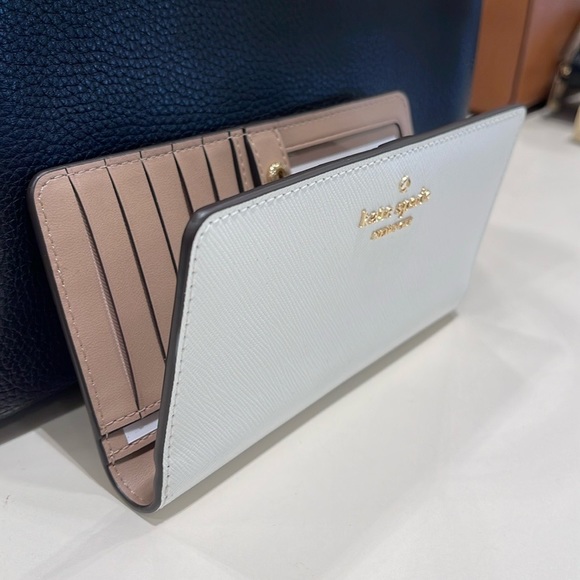 Kate Spade Madison Large Slim Bifold Wallet
Meringue 
NWT - Picture 15 of 16